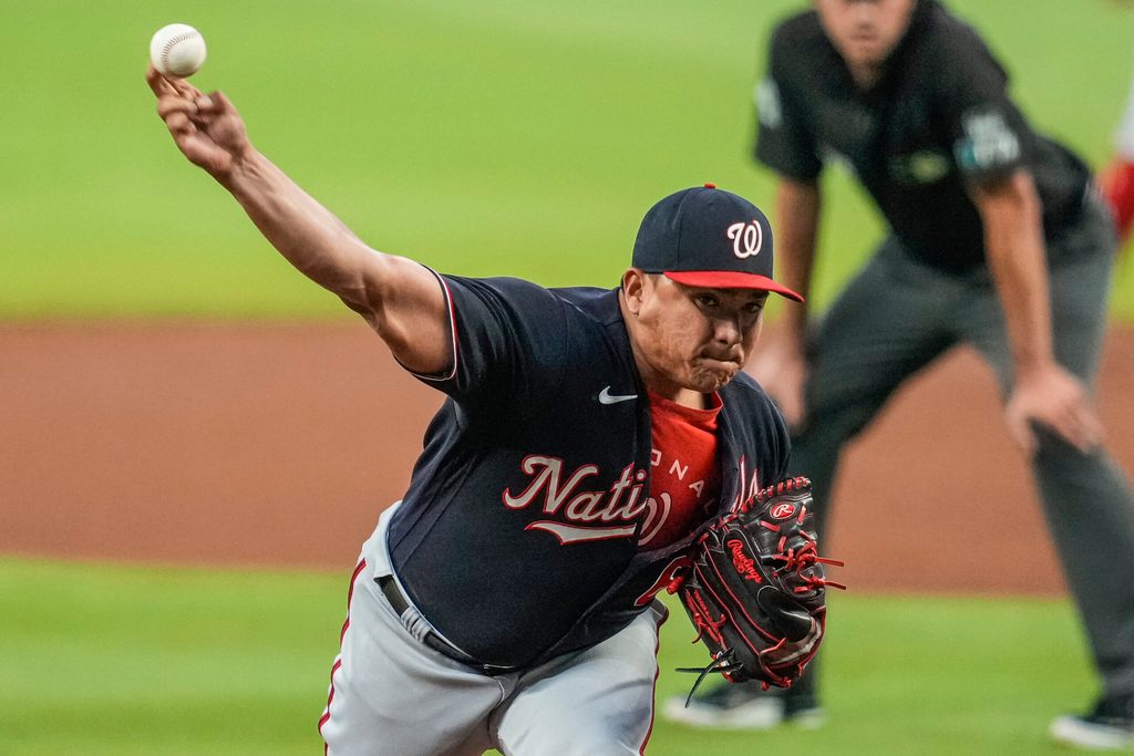 Sep 20, 2022; Cumberland, Georgia, USA; Washington Nationals Washington Nationals relief pitcher Erasmo Ramirez (61) pitches against the Atlanta Braves during the first inning at Truist Park. Mandatory Credit: Dale Zanine-Imagn Images