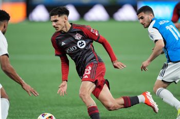 Apr 13, 2024; Charlotte, North Carolina, USA; Toronto FC defender Raoul Petretta (28)  plays the ball in the first half against the Charlotte FC at Bank of America Stadium. Mandatory Credit: Jim Dedmon-Imagn Images