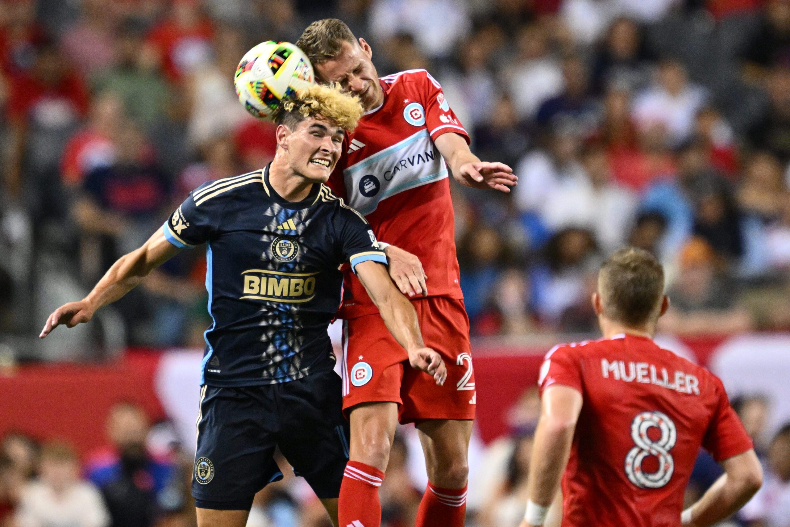 Jul 3, 2024; Chicago, Illinois, USA; Philadelphia Union midfielder Jeremy Rafanello (14) and Chicago Fire FC midfielder Fabian Herbers (21) battle for control of the ball in the second half at Soldier Field. Mandatory Credit: Jamie Sabau-Imagn Images