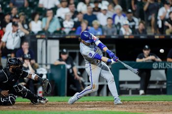 Jul 28, 2024; Chicago, Illinois, USA; Kansas City Royals shortstop Bobby Witt Jr. (7) hits a grand slam against the Chicago White Sox during the eight inning at Guaranteed Rate Field. Mandatory Credit: Kamil Krzaczynski-Imagn Images