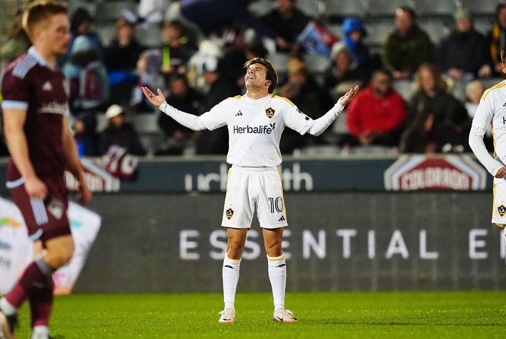 Nov 1, 2024; Commerce City, Colorado, USA; LA Galaxy midfielder Riqui Puig (10) celebrates after scoring a goal during the second half against the Colorado Rapids in a 2024 MLS Cup Playoffs Round One match at Dick's Sporting Goods Park. Mandatory Credit: Ron Chenoy-Imagn Images
