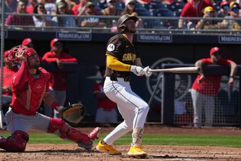 Mar 22, 2025; Peoria, Arizona, USA; San Diego Padres outfielder Jackson Merrill (3) hits against the Cincinnati Reds in the fourth inning at Peoria Sports Complex. Mandatory Credit: Rick Scuteri-Imagn Images