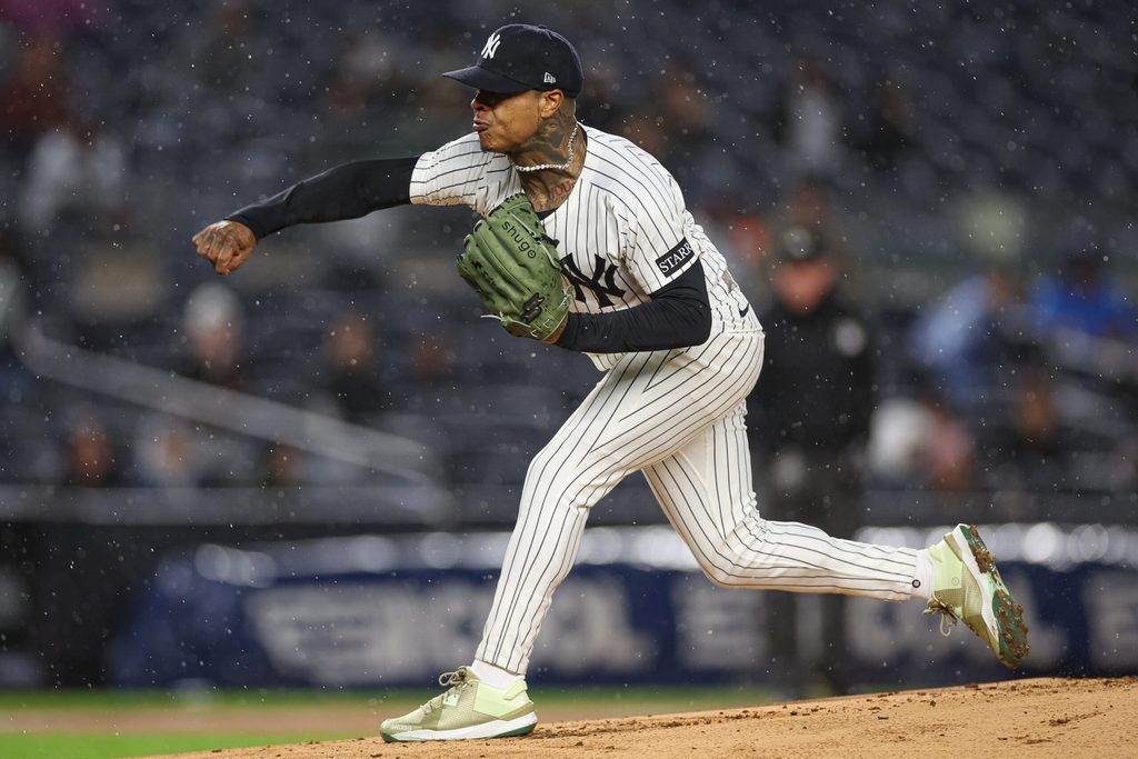 Apr 11, 2025; Bronx, New York, USA; New York Yankees starting pitcher Marcus Stroman (0) delivers a pitch during the first inning against the San Francisco Giants at Yankee Stadium. Mandatory Credit: Vincent Carchietta-Imagn Images