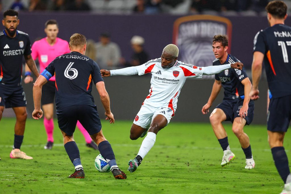 May 3, 2025; San Diego, California, USA; FC Dallas forward Bernard Kamungo (77) takes a shot during the second half against San Diego FC at Snapdragon Stadium. Mandatory Credit: Chadd Cady-Imagn Images