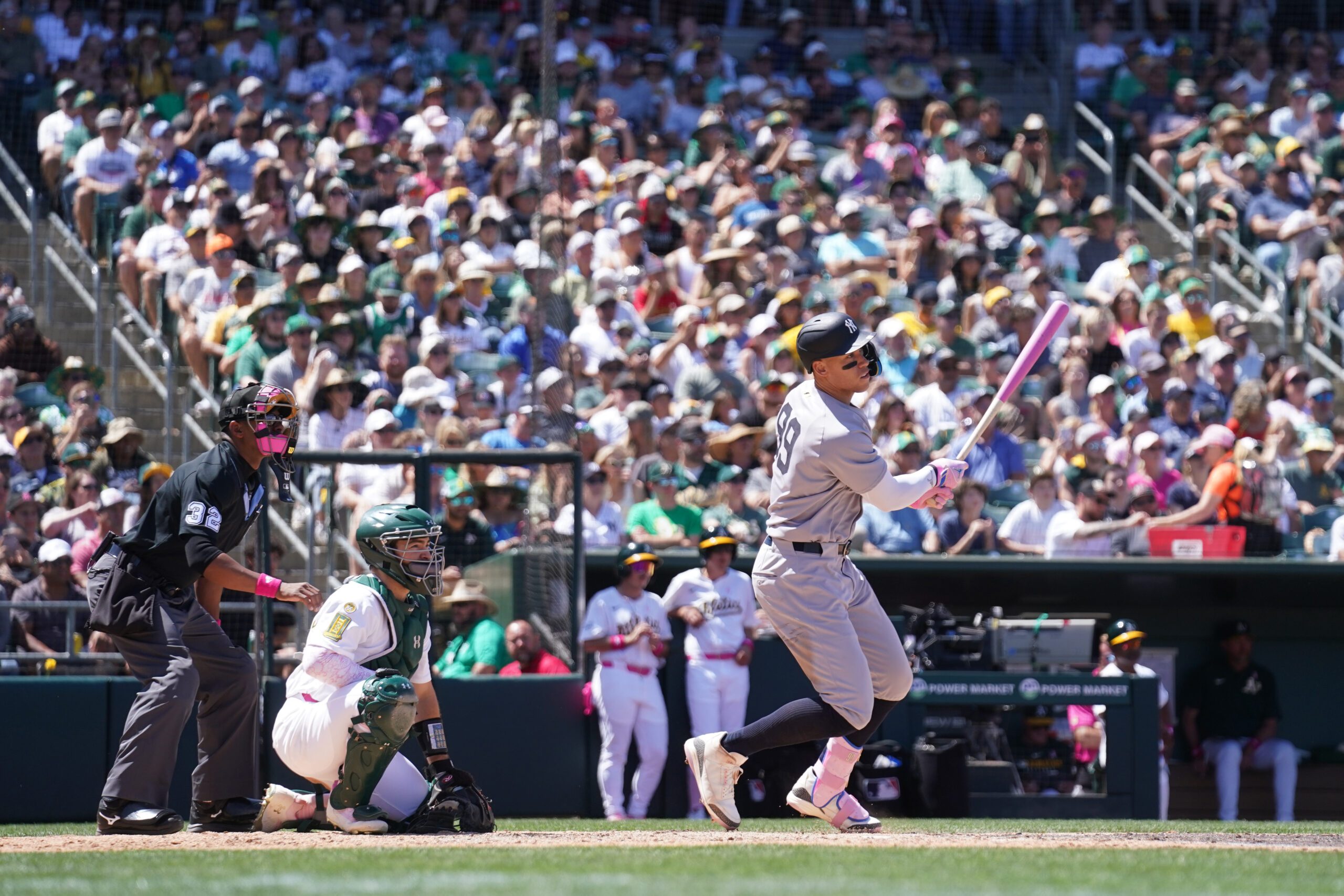 May 11, 2025; West Sacramento, California, USA; New York Yankees right fielder Aaron Judge (99) hits a single against the Athletics in the fifth inning at Sutter Health Park. Mandatory Credit: Cary Edmondson-Imagn Images