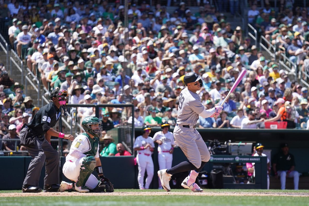 May 11, 2025; West Sacramento, California, USA; New York Yankees right fielder Aaron Judge (99) hits a single against the Athletics in the fifth inning at Sutter Health Park. Mandatory Credit: Cary Edmondson-Imagn Images