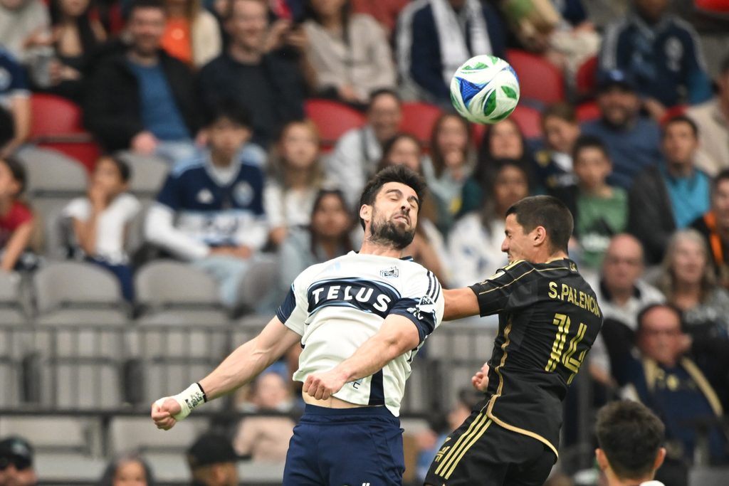 May 11, 2025; Vancouver, British Columbia, CAN; Vancouver Whitecaps FC forward Brian White (24) guhagainst Los Angeles FC defender Sergi, Palencia (14) during the second half at BC Place. Mandatory Credit: Anne-Marie Sorvin-Imagn Images