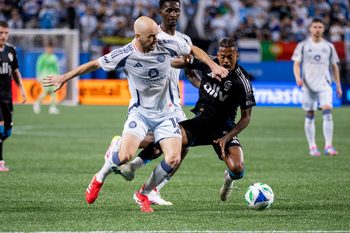 May 17, 2025; Charlotte, North Carolina, USA; Chicago Fire defender Andrew Gutman (15) knocks down Charlotte FC forward Kerwin Vargas (18) during the second half at Bank of America Stadium. Mandatory Credit: Scott Kinser-Imagn Images