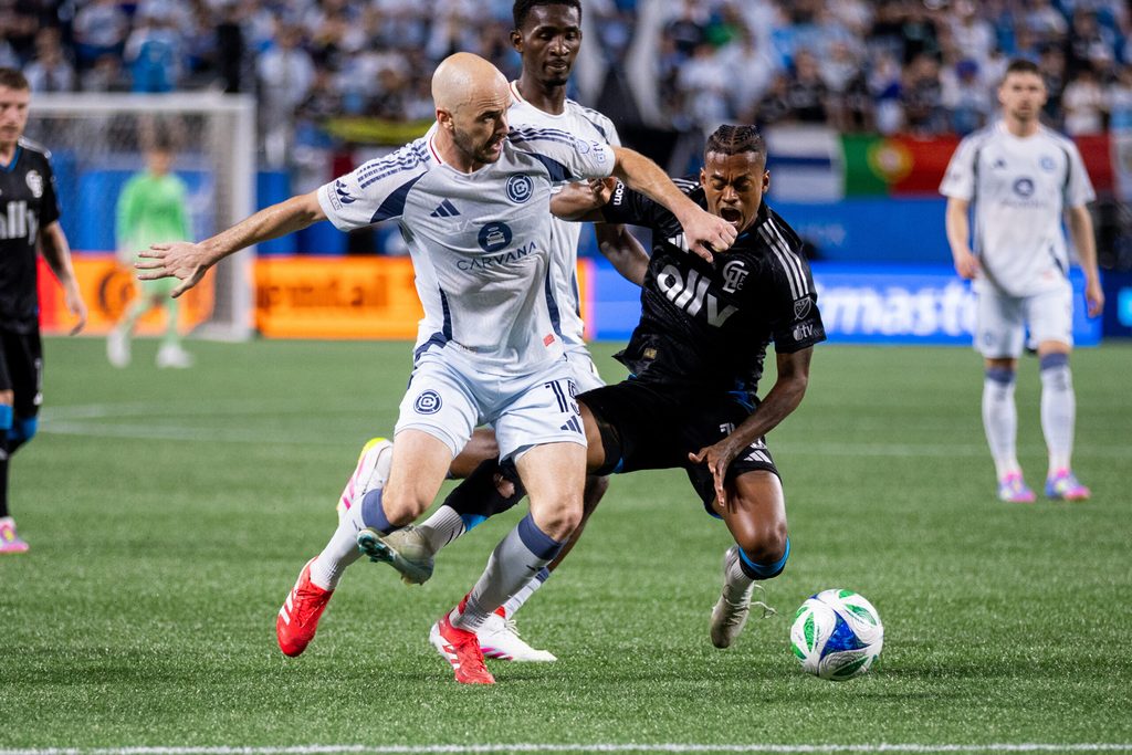 May 17, 2025; Charlotte, North Carolina, USA; Chicago Fire defender Andrew Gutman (15) knocks down Charlotte FC forward Kerwin Vargas (18) during the second half at Bank of America Stadium. Mandatory Credit: Scott Kinser-Imagn Images