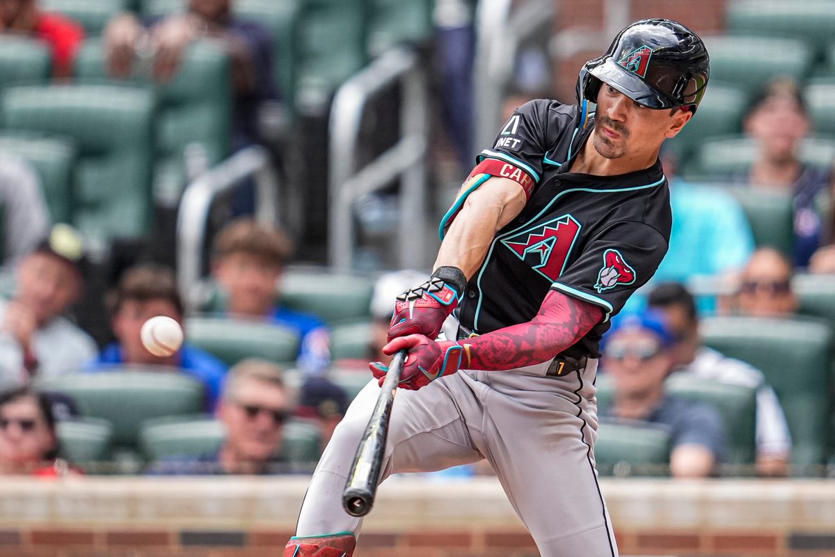 Jun 5, 2025; Cumberland, Georgia, USA; Arizona Diamondbacks right fielder Corbin Carroll (7) doubles against the Atlanta Braves during the ninth inning at Truist Park. Mandatory Credit: Dale Zanine-Imagn Images
