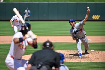 Jun 8, 2025; St. Louis, Missouri, USA;  Los Angeles Dodgers starting pitcher Clayton Kershaw (22) pitches against St. Louis Cardinals center fielder Jose Barrero (27) during the fifth inning at Busch Stadium. Mandatory Credit: Jeff Curry-Imagn Images