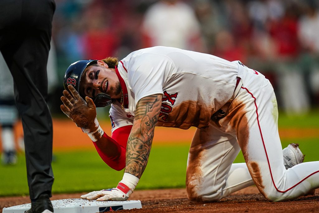 Jun 10, 2025; Boston, Massachusetts, USA; Boston Red Sox outfielder Jarren Duran (16) after sliding into third base against the Tampa Bay Rays in the third inning at Fenway Park. Mandatory Credit: David Butler II-Imagn Images