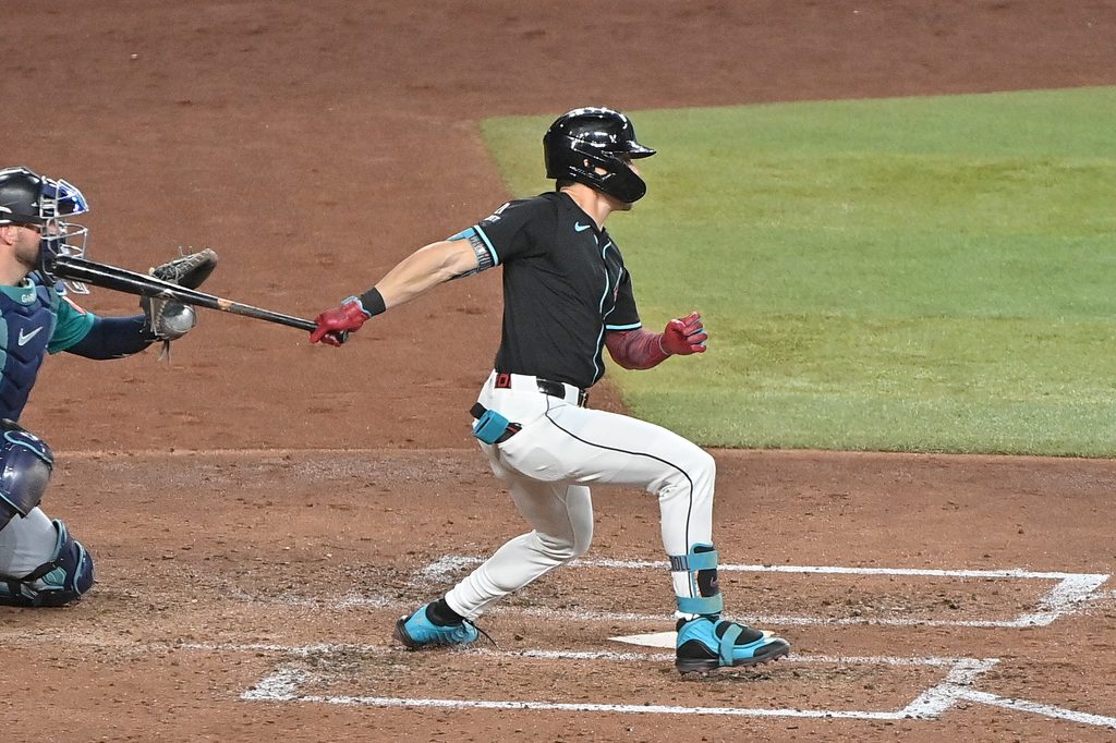 Jun 11, 2025; Phoenix, Arizona, USA; Arizona Diamondbacks outfielder Corbin Carroll (7) singles in in the sixth inning against the Seattle Mariners at Chase Field. Mandatory Credit: Matt Kartozian-Imagn Images