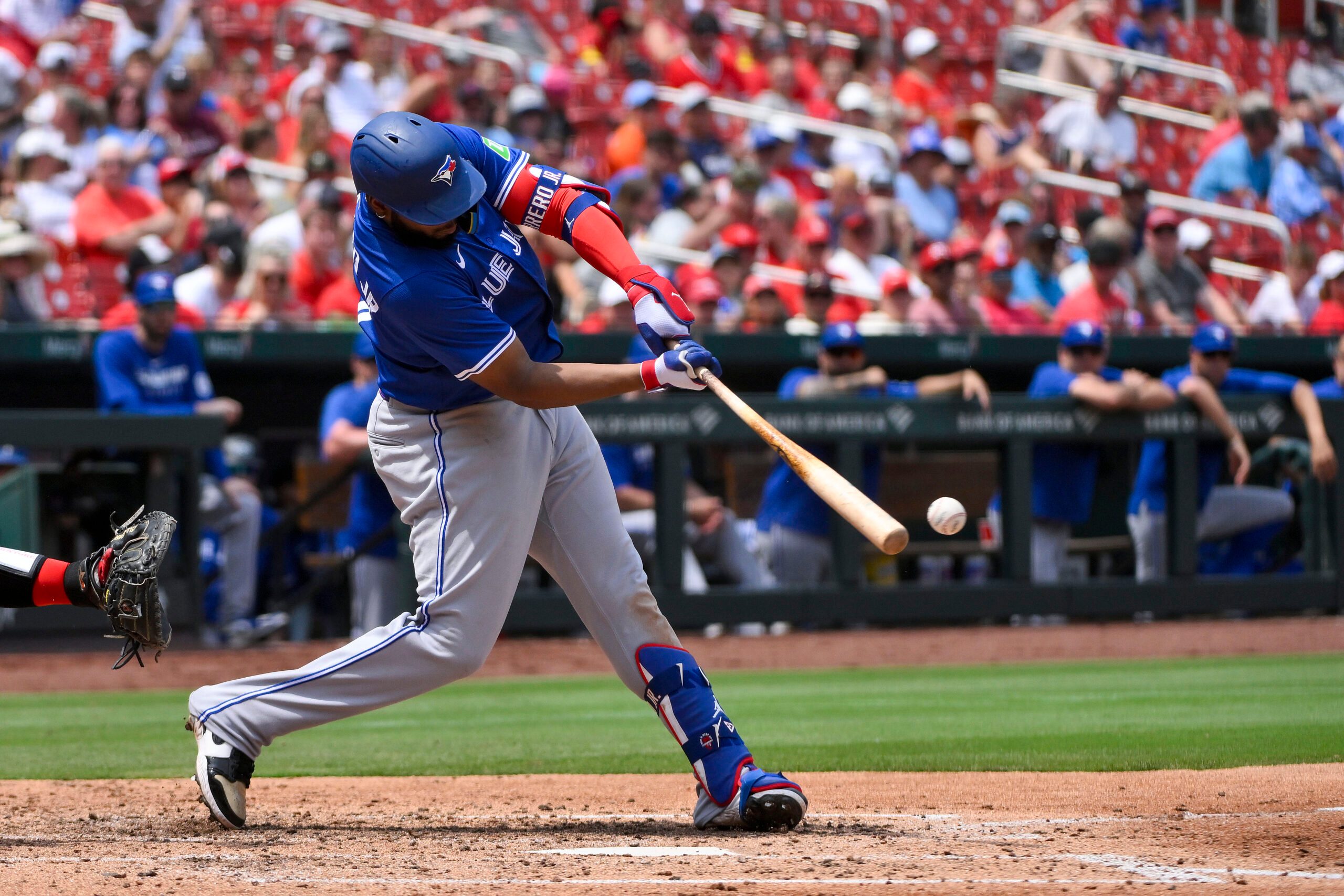 Jun 11, 2025; St. Louis, Missouri, USA;  Toronto Blue Jays first baseman Vladimir Guerrero Jr. (27) hits a one run single against the St. Louis Cardinals during the fourth inning at Busch Stadium. Mandatory Credit: Jeff Curry-Imagn Images