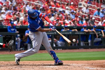 Jun 11, 2025; St. Louis, Missouri, USA;  Toronto Blue Jays first baseman Vladimir Guerrero Jr. (27) hits a one run single against the St. Louis Cardinals during the fourth inning at Busch Stadium. Mandatory Credit: Jeff Curry-Imagn Images