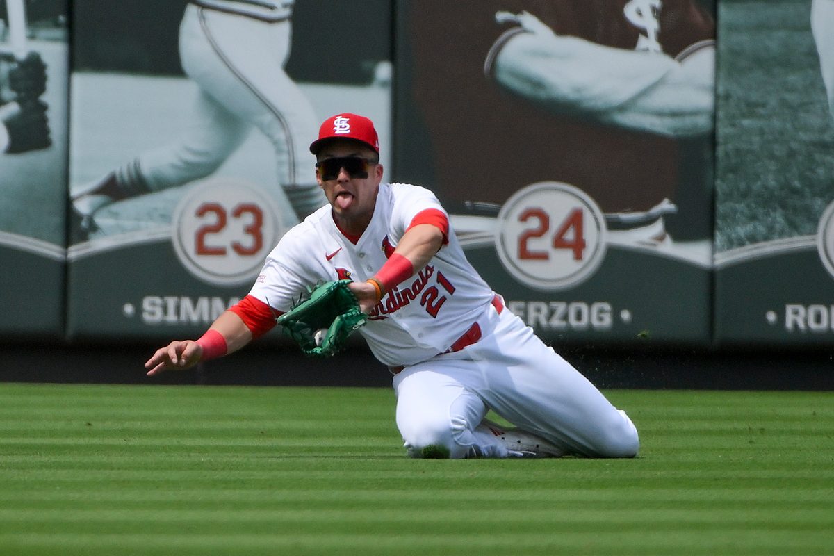 Jun 11, 2025; St. Louis, Missouri, USA;  St. Louis Cardinals left fielder Lars Nootbaar (21) slides and makes a catch against the Toronto Blue Jays during the sixth inning at Busch Stadium. Mandatory Credit: Jeff Curry-Imagn Images