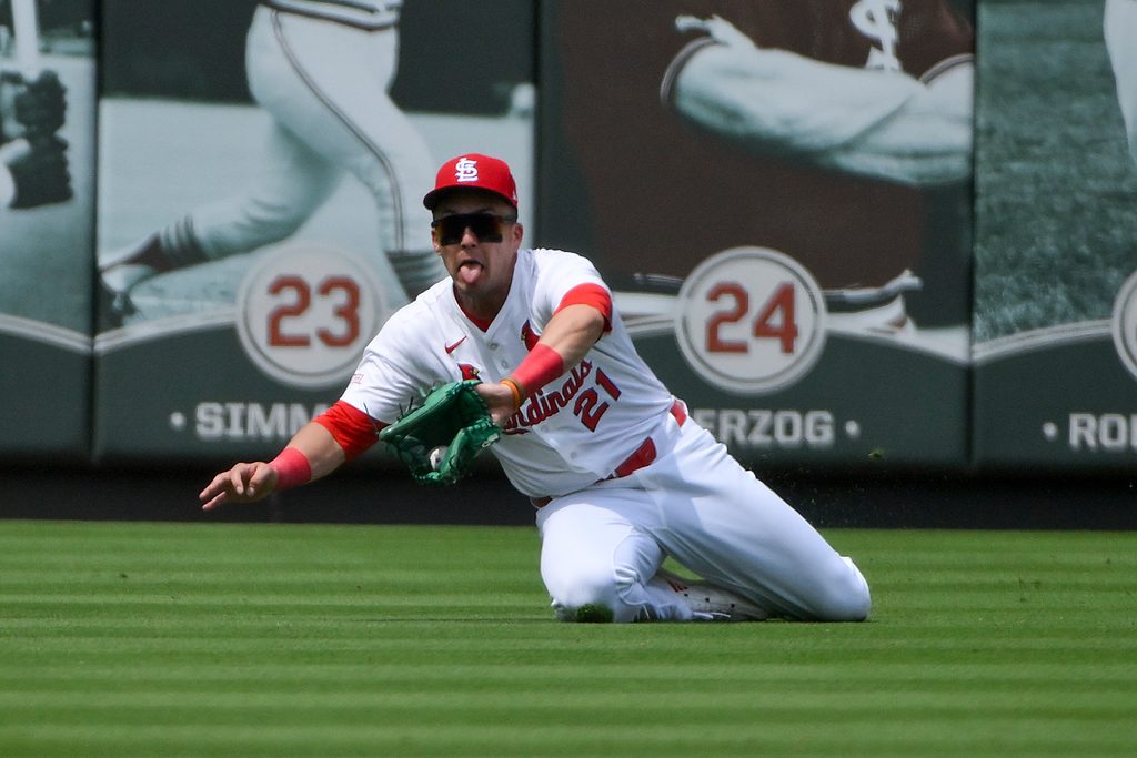 Jun 11, 2025; St. Louis, Missouri, USA; St. Louis Cardinals left fielder Lars Nootbaar (21) slides and makes a catch against the Toronto Blue Jays during the sixth inning at Busch Stadium. Mandatory Credit: Jeff Curry-Imagn Images