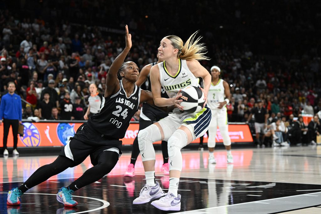 Jun 13, 2025; Las Vegas, Nevada, USA; Las Vegas Aces guard Jewell Loyd (24) collides wth Dallas Wings guard Paige Bueckers (5) in the fourth quarter of their game at Michelob Ultra Arena. Mandatory Credit: Candice Ward-Imagn Images