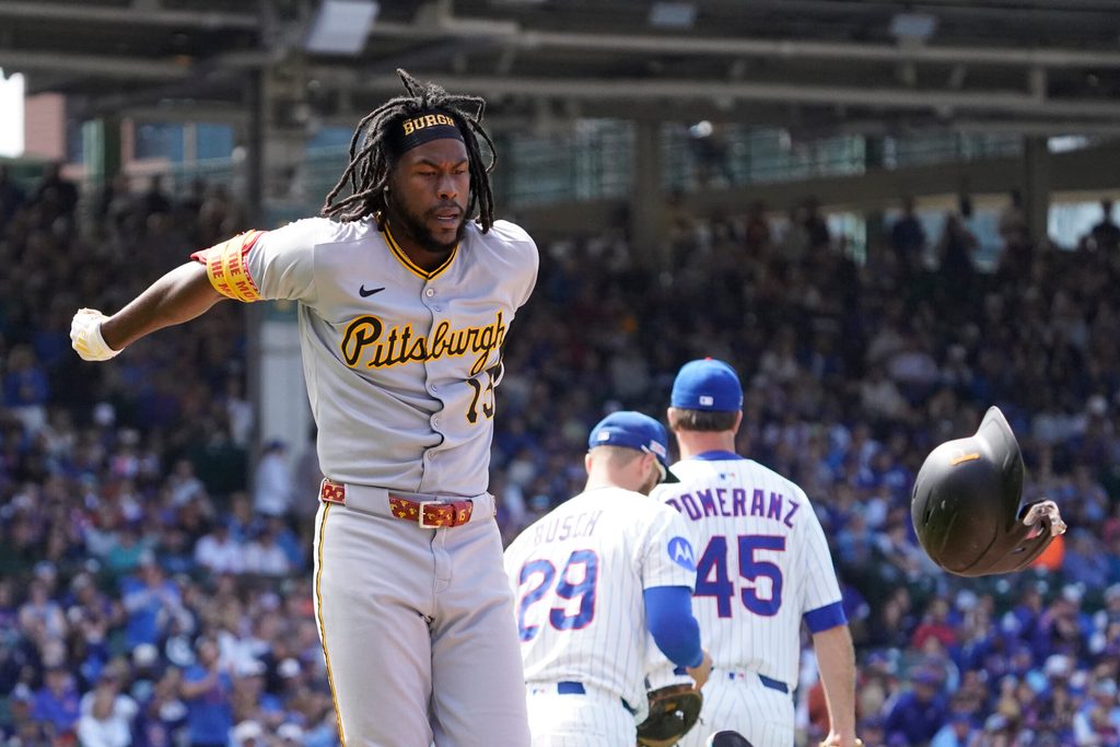 Jun 14, 2025; Chicago, Illinois, USA; Pittsburgh Pirates outfielder Oneil Cruz (15) throws his helmet after making the final out against the Chicago Cubs during the ninth inning at Wrigley Field. Mandatory Credit: David Banks-Imagn Images