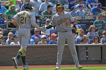 Jun 14, 2025; Kansas City, Missouri, USA;  Athletics left fielder Tyler Soderstrom (21) gets a hand from catcher Willie Maclver (65) after scoring a run in the fourth inning against the Kansas City Royals at Kauffman Stadium. Mandatory Credit: Peter Aiken-Imagn Images