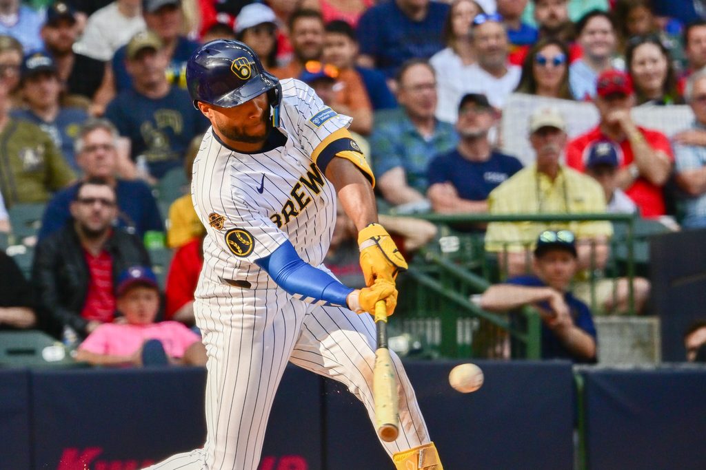 Jun 14, 2025; Milwaukee, Wisconsin, USA; Milwaukee Brewers center fielder Jackson Chourio (11) drives in a run with a base hit in the fifth inning against the St. Louis Cardinals at American Family Field. Mandatory Credit: Benny Sieu-Imagn Images