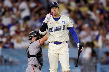 Jun 14, 2025; Los Angeles, California, USA;  Los Angeles Dodgers designated hitter Shohei Ohtani reacts after a swinging strike during the sixth inning of a baseball game against the San Francisco Giants at Dodger Stadium. Mandatory Credit: Ryan Sun-Imagn Images