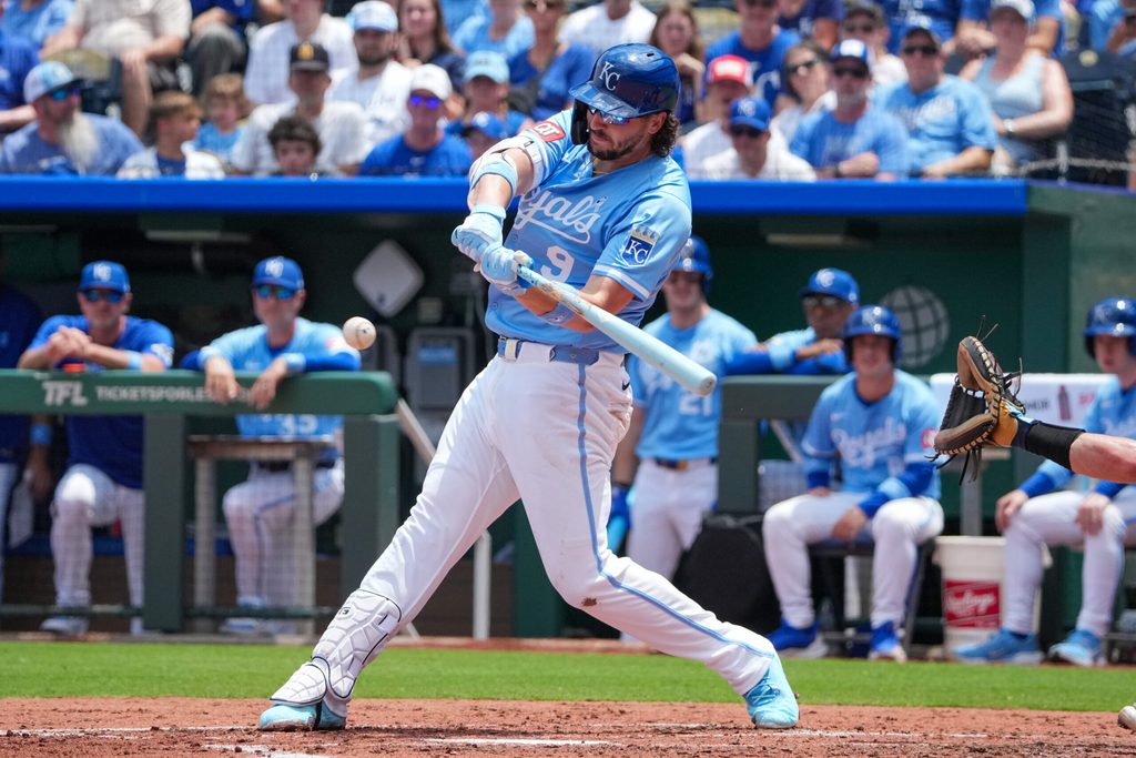 Jun 15, 2025; Kansas City, Missouri, USA; Kansas City Royals first base Vinnie Pasquantino (9) hits a one run double against the Athletics in the third inning at Kauffman Stadium. Mandatory Credit: Denny Medley-Imagn Images