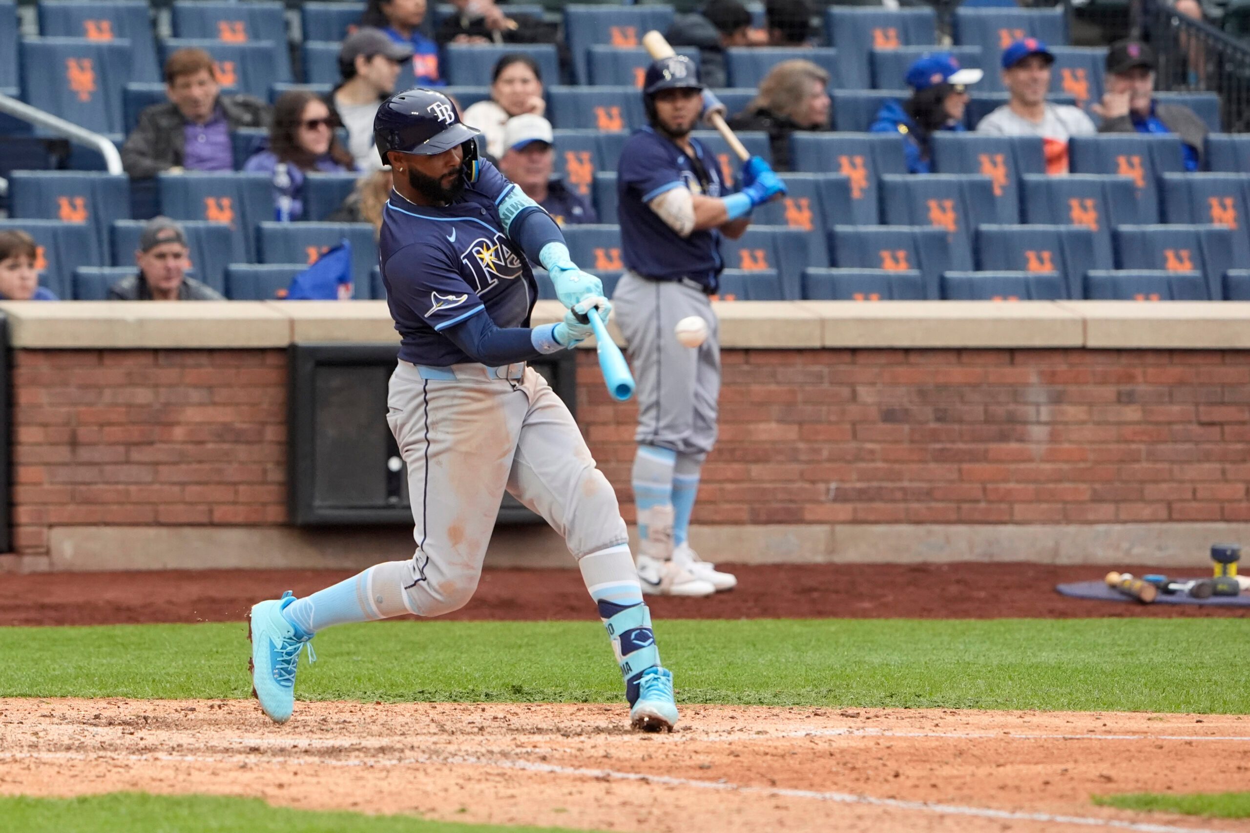 Jun 15, 2025; New York City, New York, USA;  Tampa Bay Rays designated hitter Junior Caminero (13) hits a three run home run against the New York Mets during the ninth inning at Citi Field. Mandatory Credit: Gregory Fisher-Imagn Images