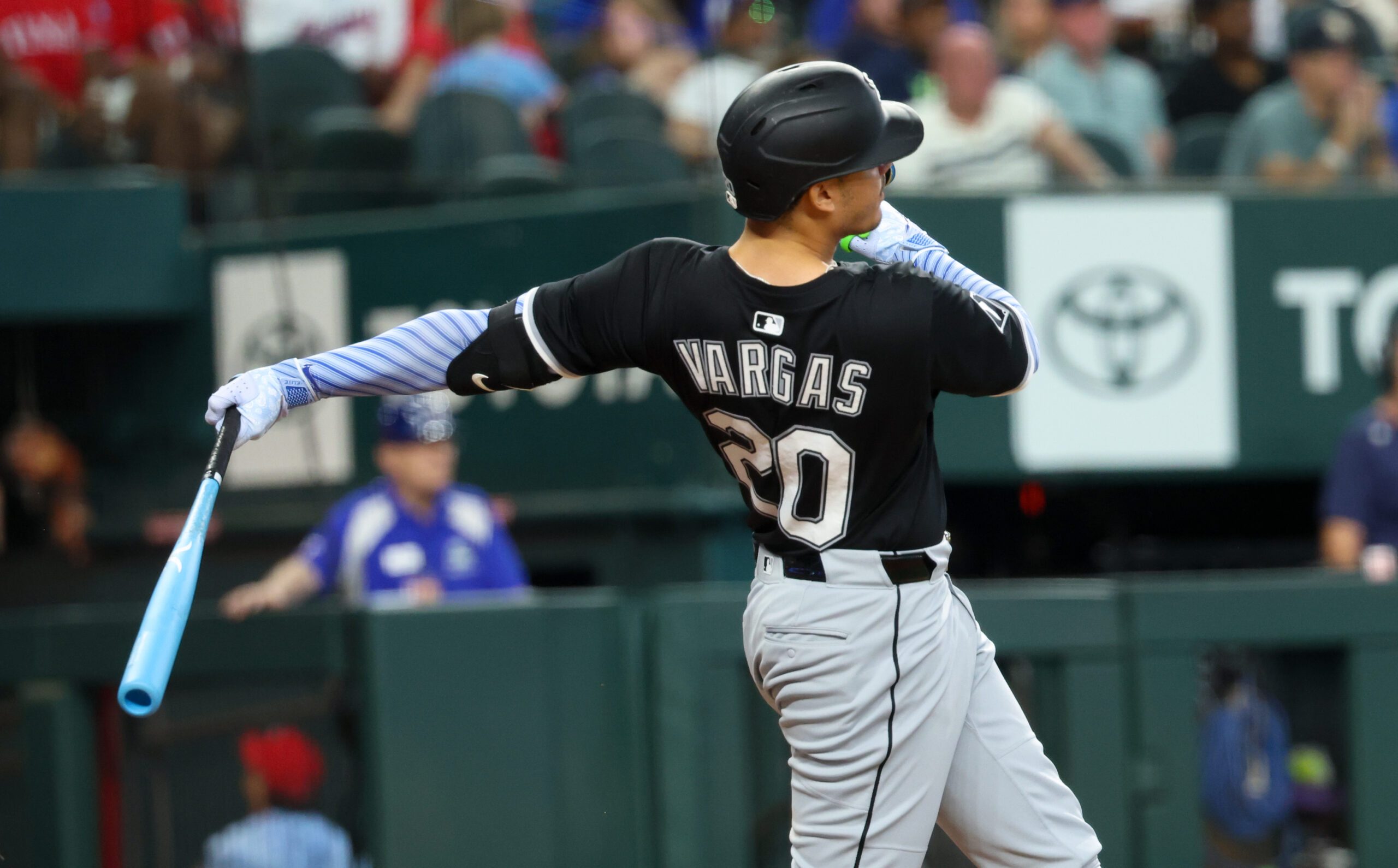 Jun 15, 2025; Arlington, Texas, USA;  Chicago White Sox third baseman Miguel Vargas (20) hits a home run during the sixth inning against the Texas Rangers at Globe Life Field. Mandatory Credit: Kevin Jairaj-Imagn Images