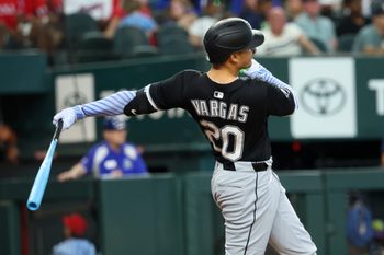 Jun 15, 2025; Arlington, Texas, USA;  Chicago White Sox third baseman Miguel Vargas (20) hits a home run during the sixth inning against the Texas Rangers at Globe Life Field. Mandatory Credit: Kevin Jairaj-Imagn Images