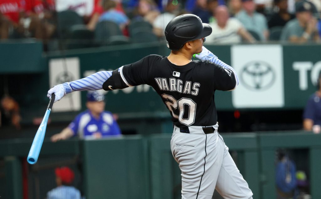 Jun 15, 2025; Arlington, Texas, USA; Chicago White Sox third baseman Miguel Vargas (20) hits a home run during the sixth inning against the Texas Rangers at Globe Life Field. Mandatory Credit: Kevin Jairaj-Imagn Images