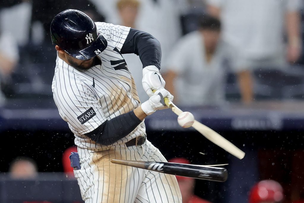 Jun 16, 2025; Bronx, New York, USA; New York Yankees left fielder Jasson Dominguez (24) breaks his bat hitting into a fielder's choice ground ball out during the eleventh inning against the Los Angeles Angels at Yankee Stadium. Mandatory Credit: Brad Penner-Imagn Images