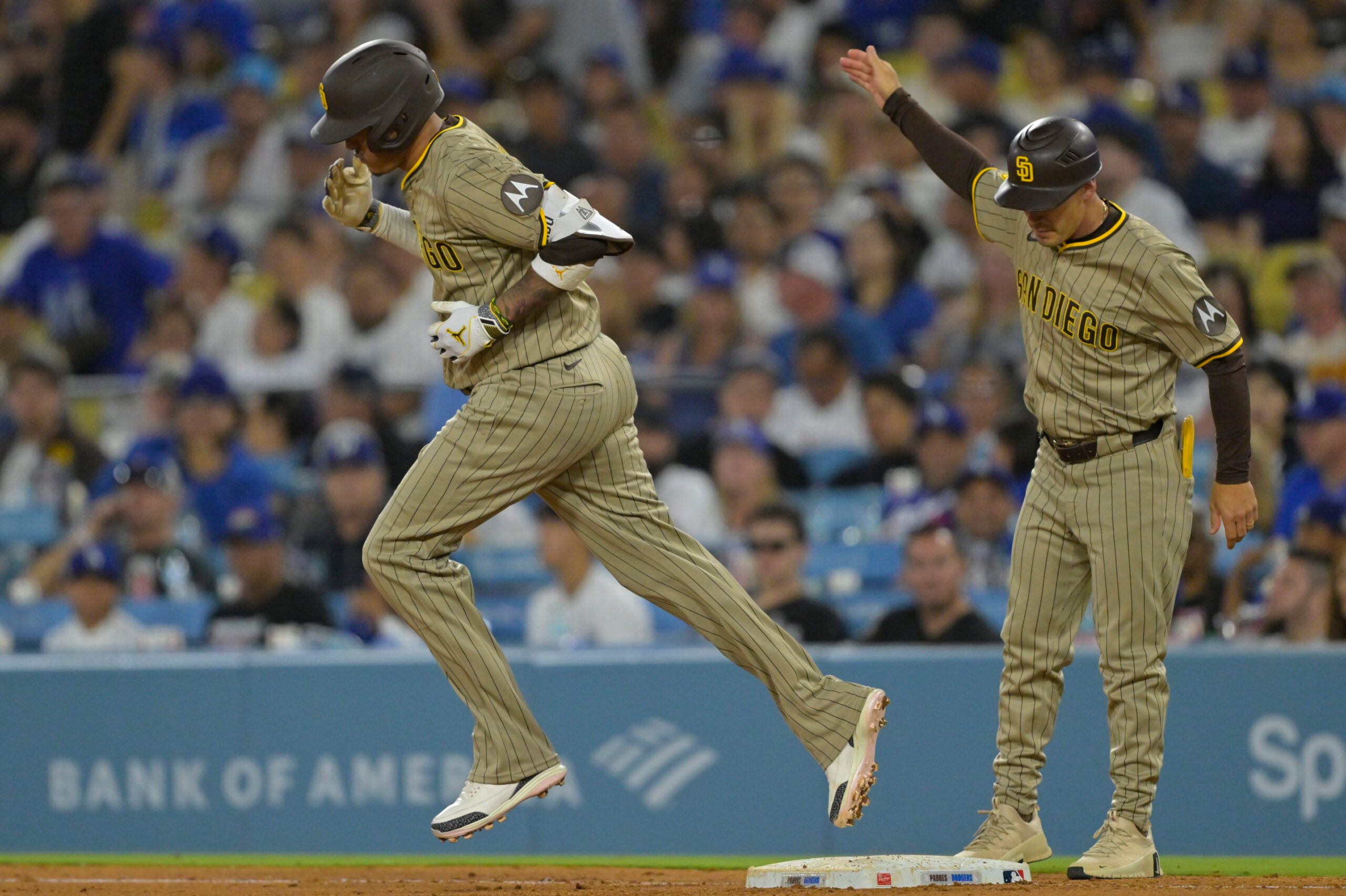 Jun 16, 2025; Los Angeles, California, USA;  San Diego Padres third baseman Manny Machado (13) rounds the bases after a solo home run in the sixth inning against the Los Angeles Dodgers at Dodger Stadium. Mandatory Credit: Jayne Kamin-Oncea-Imagn Images