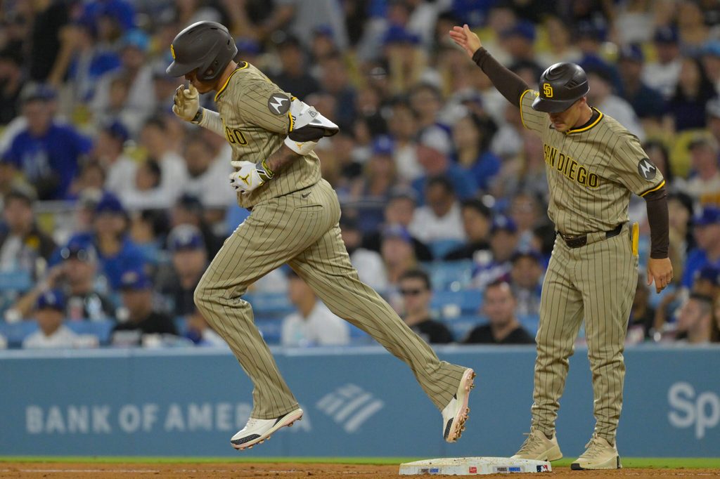 Jun 16, 2025; Los Angeles, California, USA; San Diego Padres third baseman Manny Machado (13) rounds the bases after a solo home run in the sixth inning against the Los Angeles Dodgers at Dodger Stadium. Mandatory Credit: Jayne Kamin-Oncea-Imagn Images