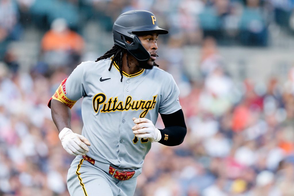 Jun 17, 2025; Detroit, Michigan, USA; Pittsburgh Pirates outfielder Oneil Cruz (15) runs to first after hitting a single in the fourth inning against the Detroit Tigers at Comerica Park. Mandatory Credit: Rick Osentoski-Imagn Images