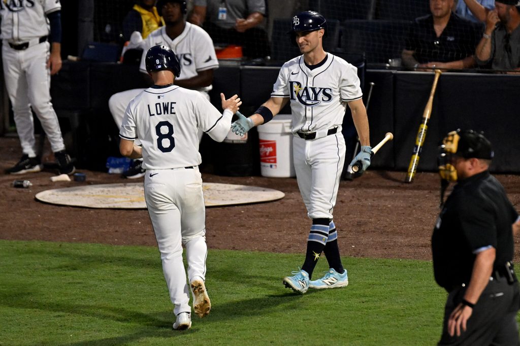 Jun 17, 2025; St. Petersburg, Florida, USA; Tampa Bay Rays second baseman Brandon Lowe (8) celebrates with left fielder Jake Mangum (28) after scoring a run in the fourth inning against the Baltimore Orioles at George M. Steinbrenner Field. Mandatory Credit: Jonathan Dyer-Imagn Images