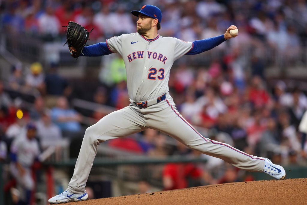 Jun 17, 2025; Atlanta, Georgia, USA; New York Mets starting pitcher David Peterson (23) throws against the Atlanta Braves in the first inning at Truist Park. Mandatory Credit: Brett Davis-Imagn Images