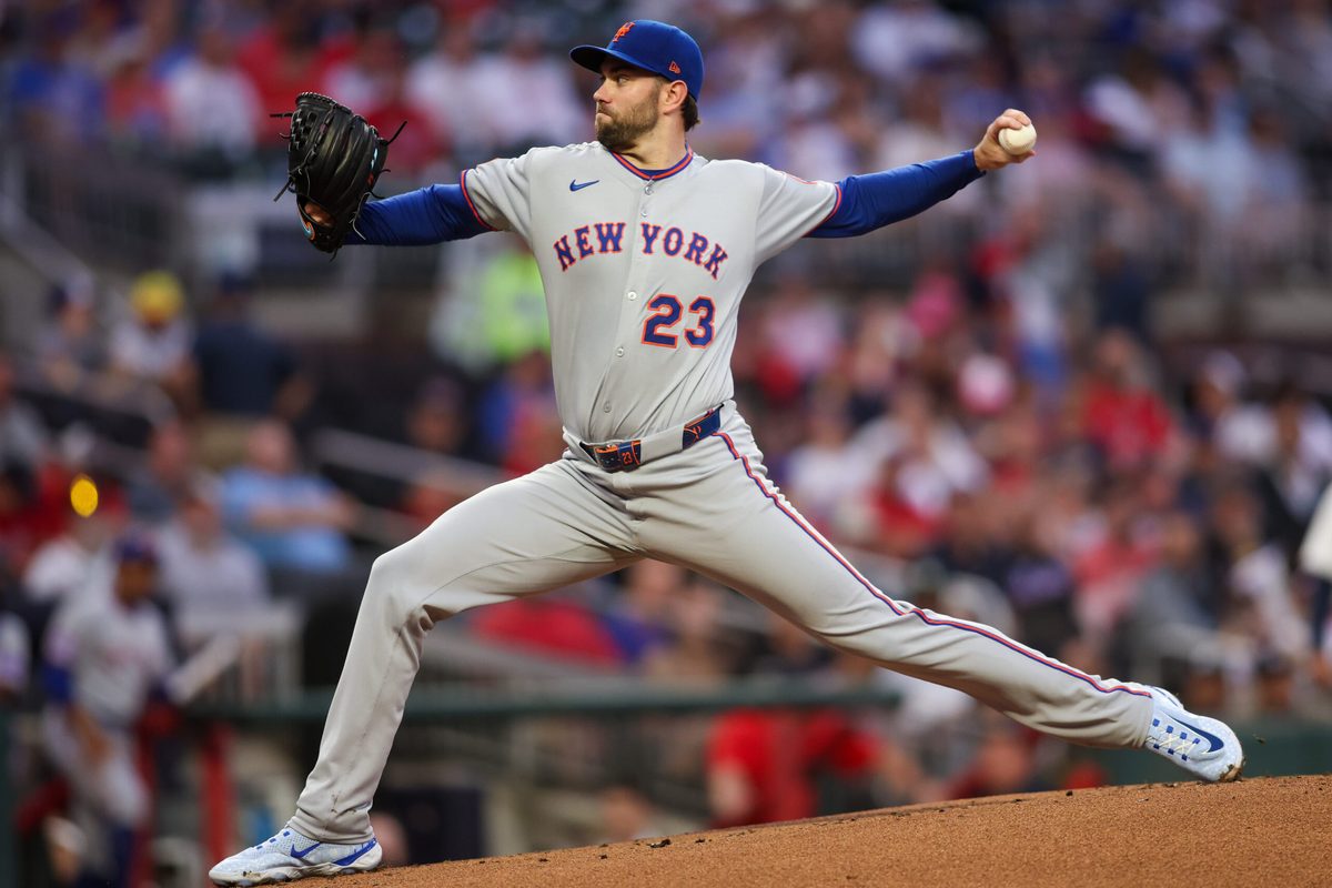 Jun 17, 2025; Atlanta, Georgia, USA; New York Mets starting pitcher David Peterson (23) throws against the Atlanta Braves in the first inning at Truist Park. Mandatory Credit: Brett Davis-Imagn Images
