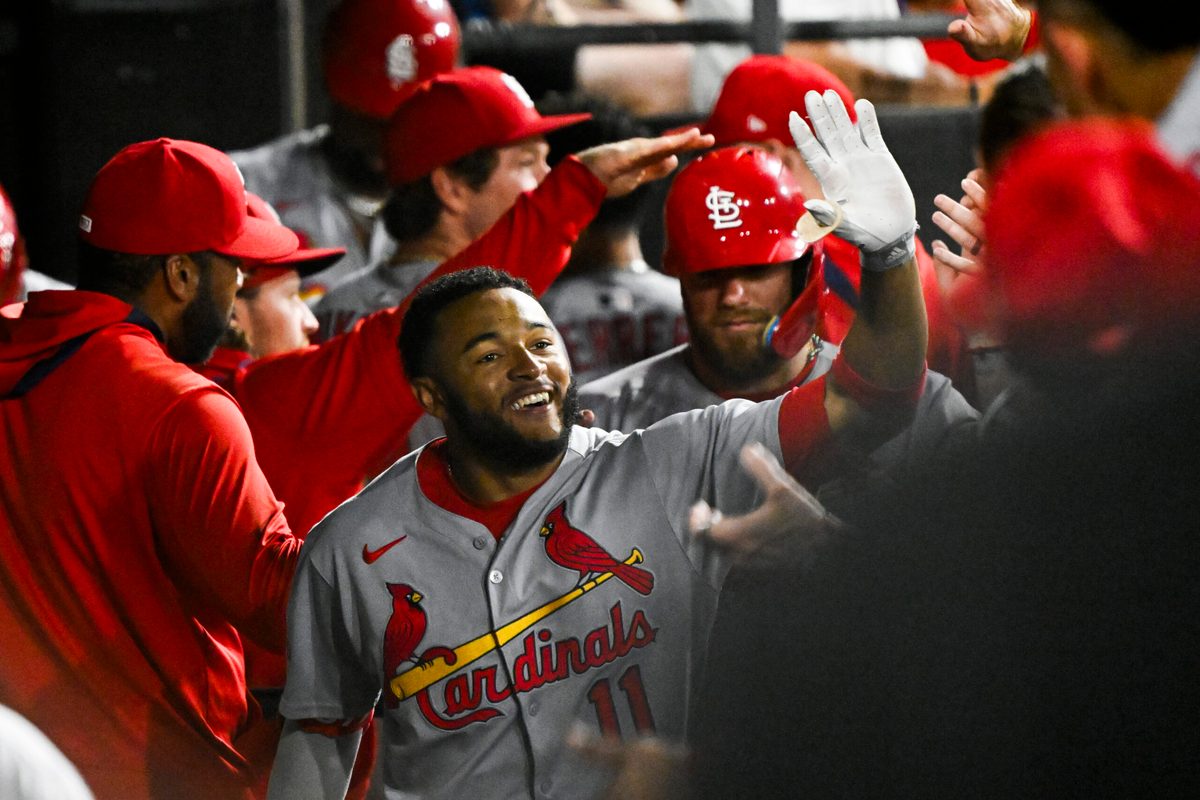 Jun 17, 2025; Chicago, Illinois, USA;  St. Louis Cardinals outfielder Victor Scott II (11) celebrates in the dugout after hitting a two-run home run against the Chicago White Sox during the ninth inning at Rate Field. Mandatory Credit: Matt Marton-Imagn Images
