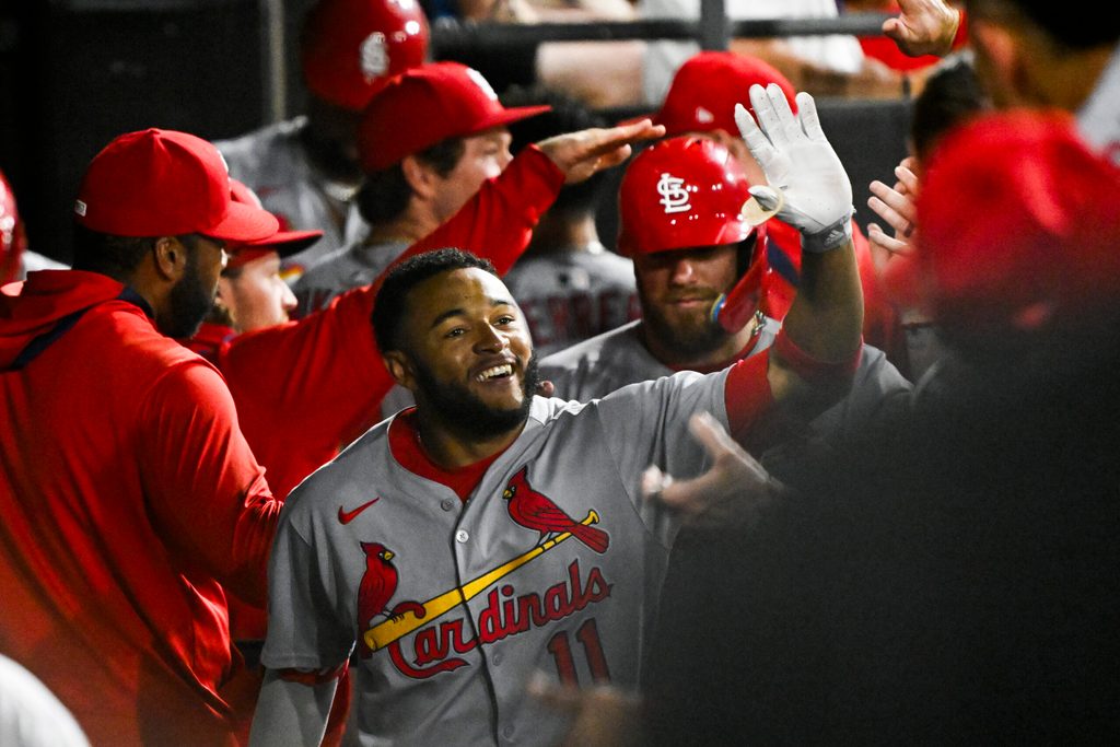Jun 17, 2025; Chicago, Illinois, USA;  St. Louis Cardinals outfielder Victor Scott II (11) celebrates in the dugout after hitting a two-run home run against the Chicago White Sox during the ninth inning at Rate Field. Mandatory Credit: Matt Marton-Imagn Images