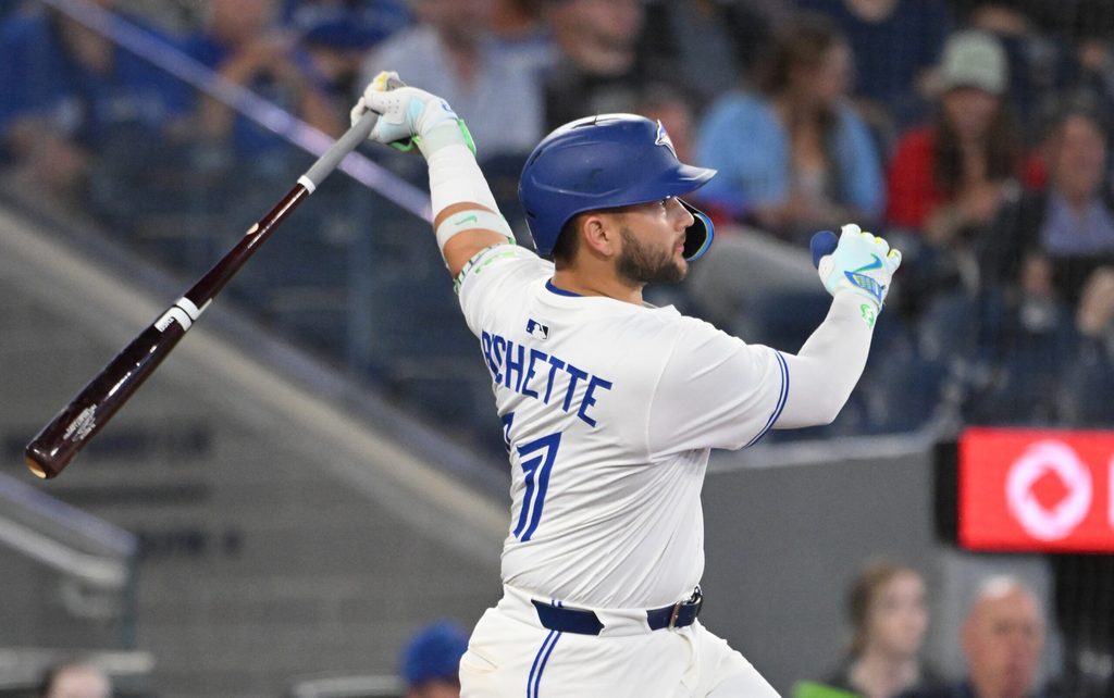 Jun 17, 2025; Toronto, Ontario, CAN; Toronto Blue Jays shortstop Bo Bichette (11) hits a solo home run against the Arizona Diamondbacks in the ninth inning at Rogers Centre. Mandatory Credit: Dan Hamilton-Imagn Images
