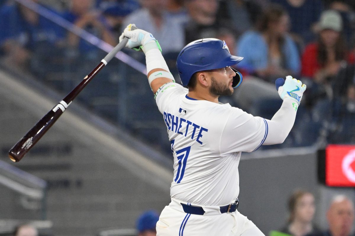Jun 17, 2025; Toronto, Ontario, CAN; Toronto Blue Jays shortstop Bo Bichette (11) hits a solo home run against the Arizona Diamondbacks in the ninth inning at Rogers Centre. Mandatory Credit: Dan Hamilton-Imagn Images