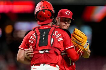 Cincinnati Reds pitcher Emilio Pagán (15) and catcher Tyler Stephenson (37) celebrate the final out of the ninth inning of the MLB interleague game between the Cincinnati Reds and the Minnesota Twins at Great American Ball Park in downtown Cincinnati on Tuesday, June 17, 2025. The Reds won 6-5.
