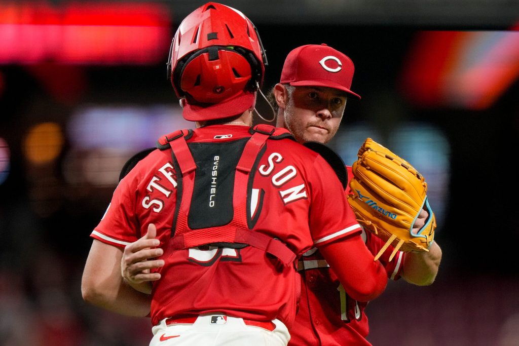 Cincinnati Reds pitcher Emilio Pagán (15) and catcher Tyler Stephenson (37) celebrate the final out of the ninth inning of the MLB interleague game between the Cincinnati Reds and the Minnesota Twins at Great American Ball Park in downtown Cincinnati on Tuesday, June 17, 2025. The Reds won 6-5.