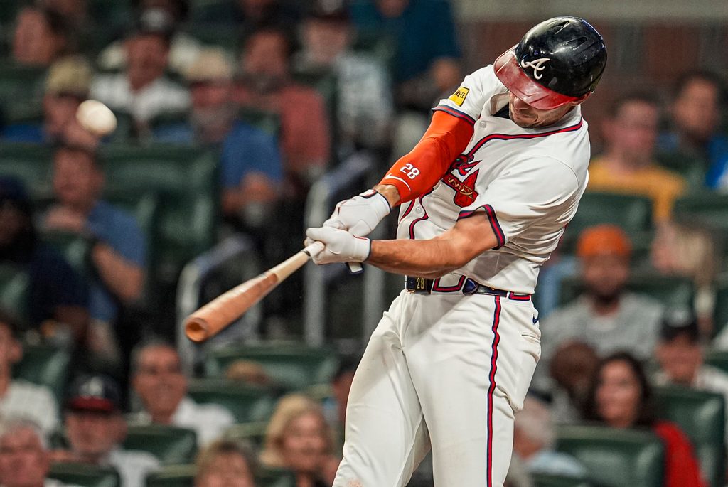 Jun 18, 2025; Cumberland, Georgia, USA; Atlanta Braves first baseman Matt Olson (28) hits a home run against the New York Mets during the seventh inning at Truist Park. Mandatory Credit: Dale Zanine-Imagn Images