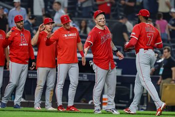 Jun 18, 2025; Bronx, New York, USA; Los Angeles Angels center fielder Jo Adell (7) and designated hitter Mike Trout (27) celebrate with teammates after defeating the New York Yankees at Yankee Stadium. Mandatory Credit: Vincent Carchietta-Imagn Images