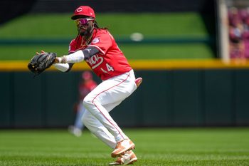 Cincinnati Reds shortstop Elly De La Cruz (44) backhands a sharply hit ground ball off the bat of Harrison Bader in the ninth inning of the MLB interleague game between the Cincinnati Reds and the Minnesota Twins at Great American Ball Park in downtown Cincinnati on Thursday, June 19, 2025. The Twins won, 12-5.