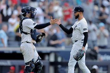 Jun 19, 2025; Bronx, New York, USA; New York Yankees catcher Austin Wells (28) and relief pitcher Devin Williams (38) celebrate after defeating the Los Angeles Angels at Yankee Stadium. Mandatory Credit: Brad Penner-Imagn Images