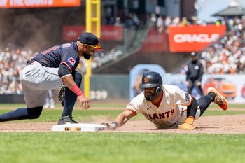 Jun 19, 2025; San Francisco, California, USA; San Francisco Giants outfielder Heliot Ramos (17) beats the tag during the sixth inning against the Cleveland Guardians at Oracle Park. Mandatory Credit: Bob Kupbens-Imagn Images