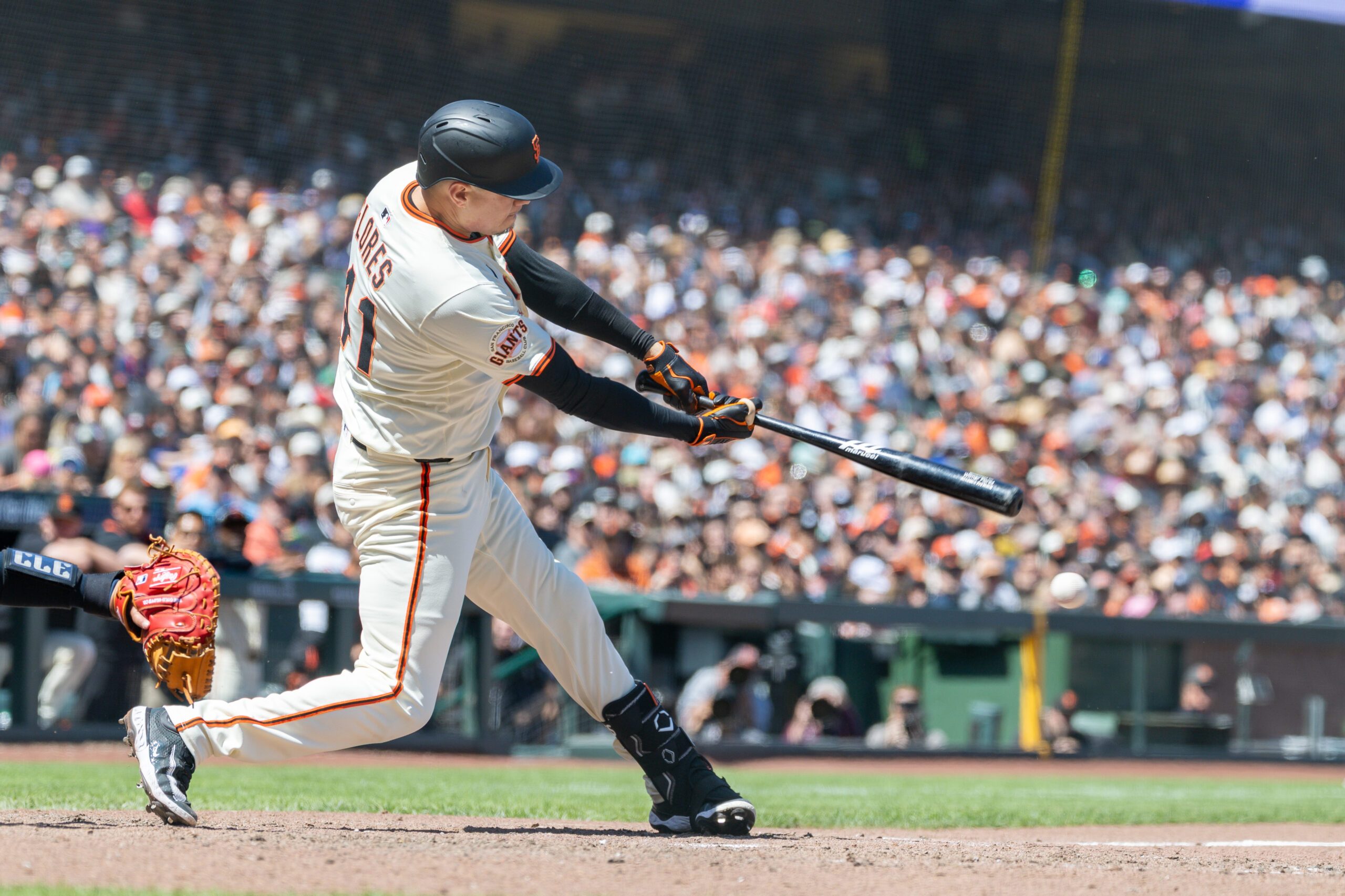 Jun 19, 2025; San Francisco, California, USA; San Francisco Giants first base Wilmer Flores (41) hits a double to score 2 runs during the seventh inning against the Cleveland Guardians at Oracle Park. Mandatory Credit: Bob Kupbens-Imagn Images